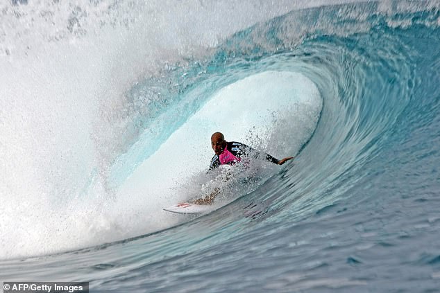 Slater is also using a dead man's body part to hold his hip together (pictured competing at the Billabong Pro in Tahiti).
