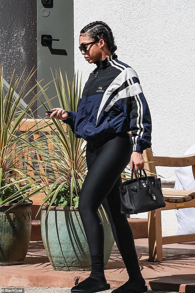 Harvey stepped out in a stylish Balenciaga zip-up sports jacket and her black hair in braids.
