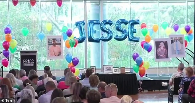 The auditorium stage was decorated with colorful balloons and photographs of Jesse.