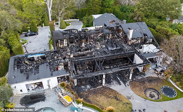 Much of the roof of Cara's house has been destroyed by the fire, and the kitchen and bedrooms are now visible from the air.