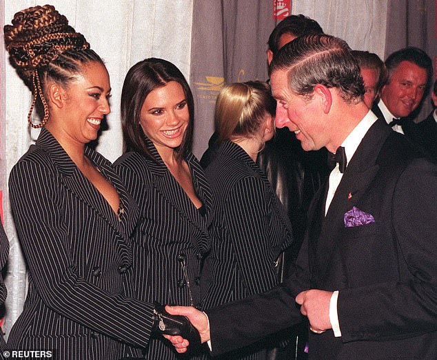 The Prince of Wales shakes hands with Scary Spice (Mel B) when he meets the Spice Girls at the gala premiere of Spiceworld, The Movie on 15 December 1997.