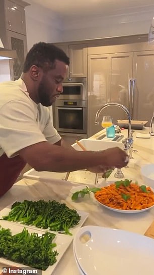 A built-in oven is seen in the background as Diddy prepares what appears to be a healthy pasta dish.
