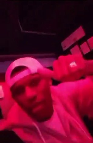 One clip shows Robert Arboleda holding and throwing cash at a stripper at a nightclub.