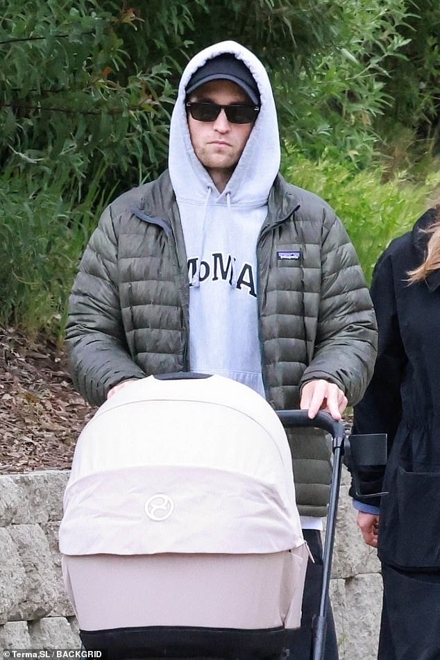 She kept a low profile with her hood up and donned dark sunglasses while out with her partner and newborn.
