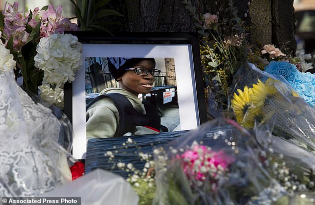 A photo of Jayden Perkins, an 11-year-old boy who was stabbed to death in his home, seen at a memorial in front of Perkin's home in Chicago.