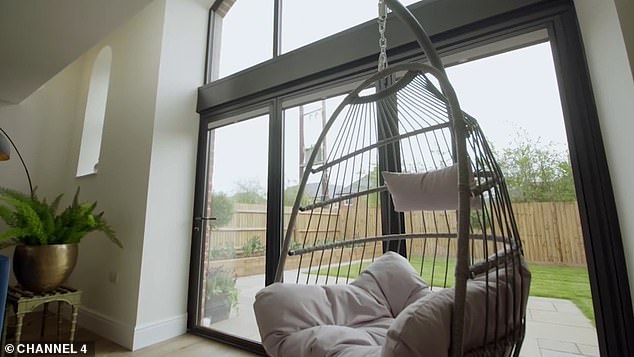 The couple had builders install a woven hanging chair in one of the living spaces.