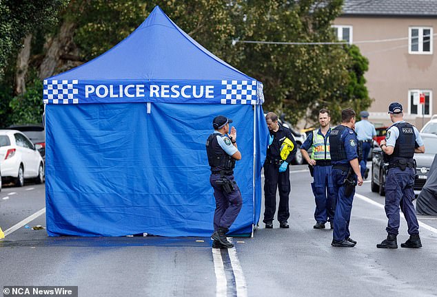 Pictured, officers process the crime scene in Tamarama on Sunday after the alleged hit-and-run.