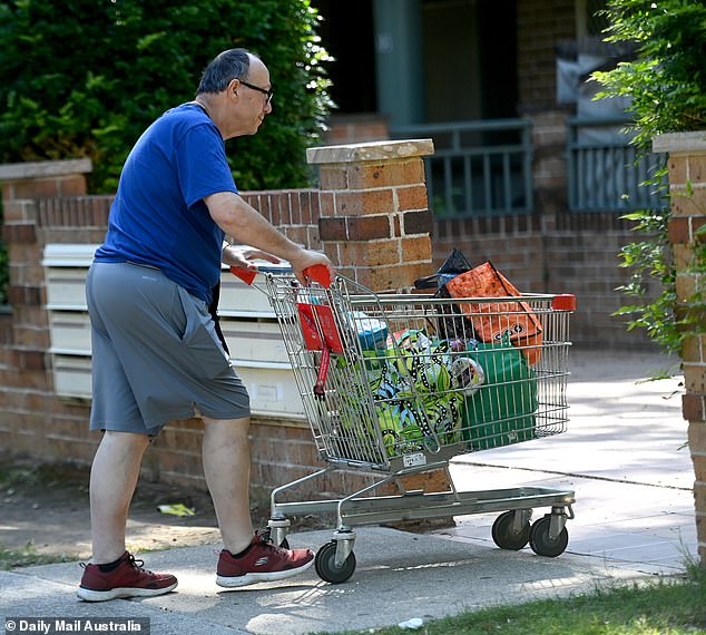 A neighbor was seen delivering groceries in a trolley to Mr Kokotatsios (above, with the trolley) at his home in Sydney's southwest on Tuesday.