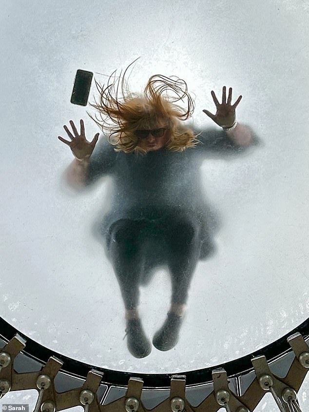 Captured with an iPhone 14 Pro, this unique photo shows photographer Sarah's friend Valerie face down on the glass floor of The Hive in the Royal Botanic Gardens, Kew.