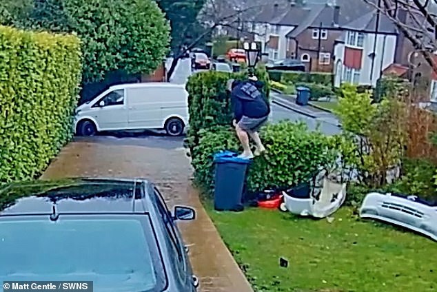 The father of two climbed onto the bin and attempted to change the battery on two security cameras.