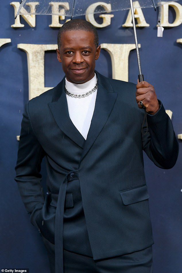 Adrian Lester, who plays the Earl of Poynton in the series, put on a dapper display in a crisp white turtleneck under a smart navy suit.