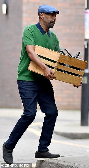 He was wearing a bright green polo shirt, navy blue pants and a flat cap.