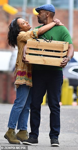 The actor, who stars in the upcoming adaptation as Clint Donovan, smiled as he walked around carrying a wooden basket.