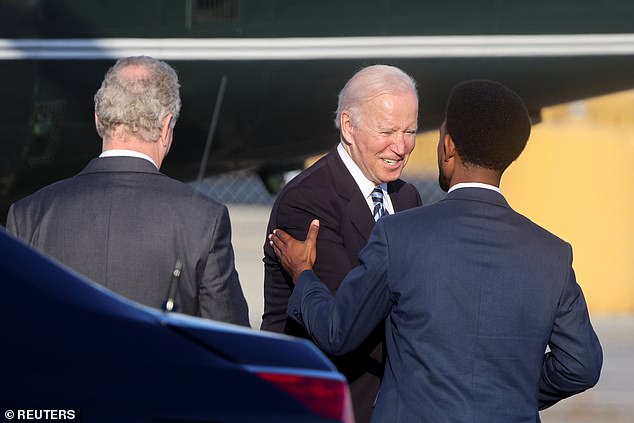 President Joe Biden is greeted by Scott at an event in 2021