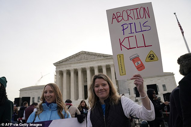 Anti-abortion protesters outside the Supreme Court on Tuesday, where the justices would hear FDA v. Alliance for Hippocratic Medicine.