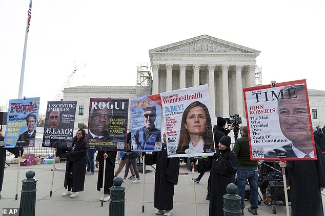 Pro-abortion rights protesters criticize conservative Supreme Court justices Tuesday ahead of the mifepristone hearing.