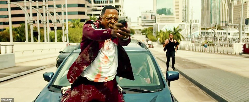 The Men in Black star, 55, shared and Lawrence, 58, were seen firing guns non-stop in the action-packed clip.