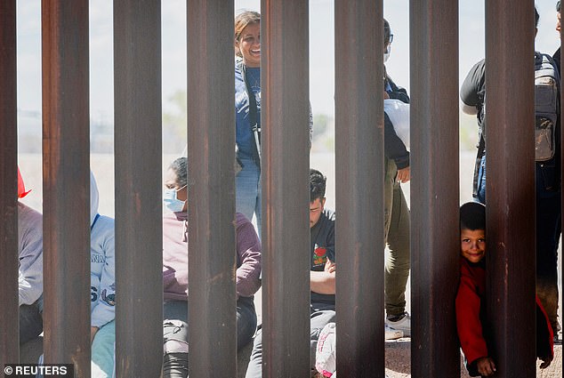 The migrant families who were part of the mob of 600 people are waiting to be processed by the US Border Patrol.