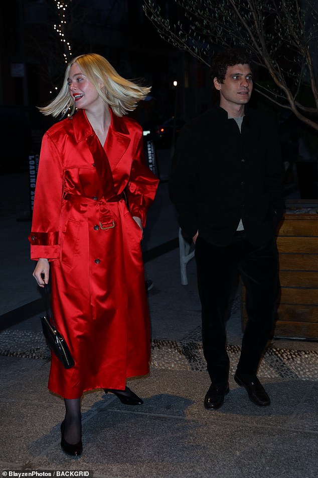 Arriving at the private event in New York City, the three-time Golden Globe nominee, 25, looked stunning in a vibrant red trench coat, black stockings and high heels.