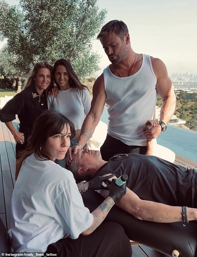 In several Instagram photos, the couple is seen getting inked by talented Bang Bang tattoo artist Corina Weikl at a private residence in Los Angeles.  One captured Chris holding Matt's hand as Weikl crafted the design on his right bicep, while her wives Elsa Pataky and Luciana Barroso looked on.