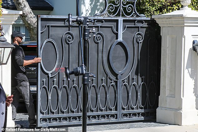 The doors to Diddy's mansion in Los Angeles open for the boys to leave.