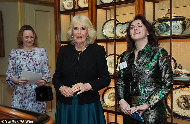 Queen Camilla (centre) and director of The Queen's Reading Room, Vicki Perrin (right) during a reception to mark the findings of a new research study commissioned by The Queen's Reading Room charity, at Clarence House.