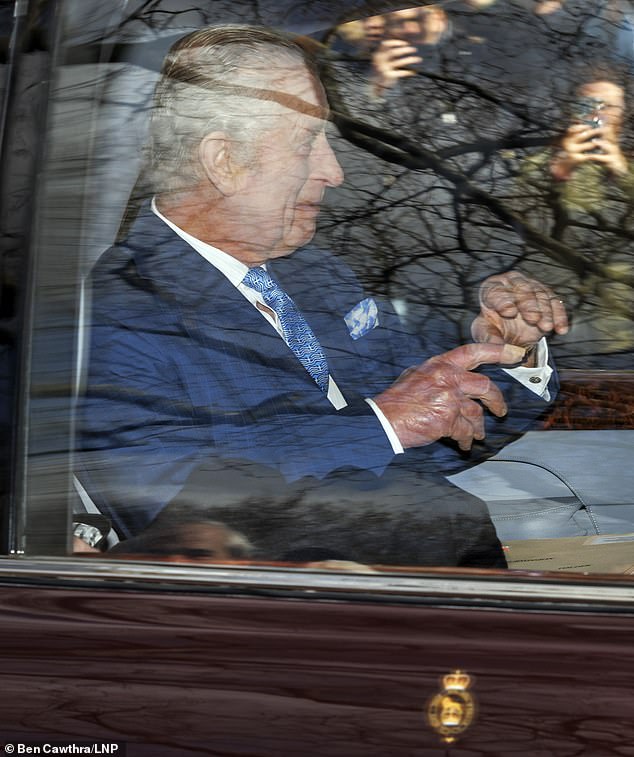King Charles III greets smiling members of the public as he leaves Clarence House today