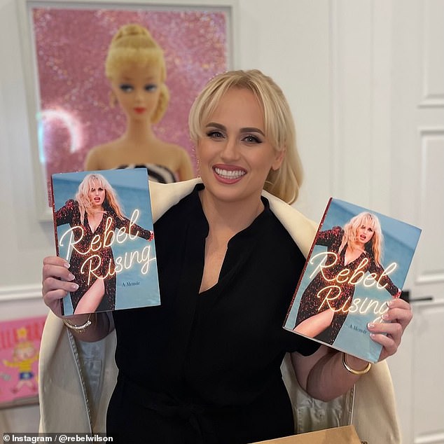 Rebel has now claimed she had an uncomfortable experience while filming the comedy (claims which Sacha has said are false and contradicted by evidence) and shared details in a new excerpt from her autobiography (pictured with her book).