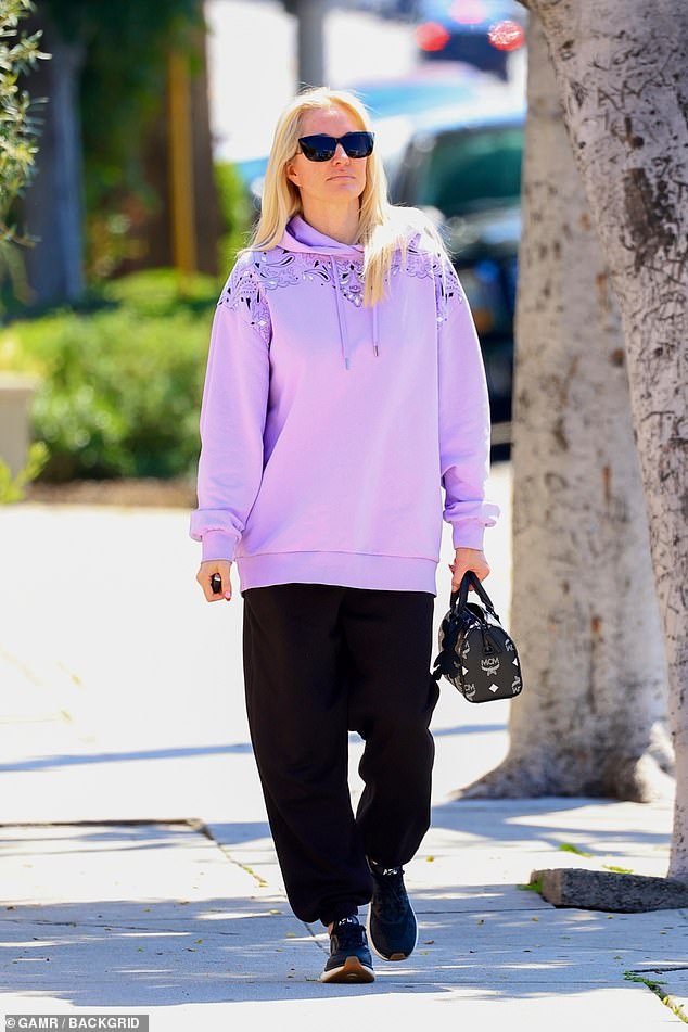 Following her much-needed pampering session after wrapping season 13 of Real Housewives of Beverly Hills, the reality star, 52, smiled as she walked back to her car wearing an oversized purple hoodie, pants black sports shoes and sneakers.