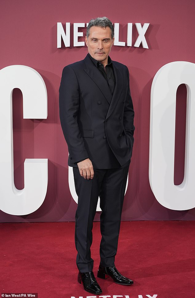 Rufus Sewell, who plays Prince Andrew in the drama, looked dapper in a black suit.