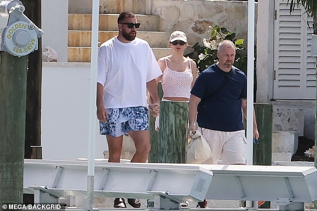 Travis showed off his own fashion style in a loose-fitting white T-shirt and printed shorts.