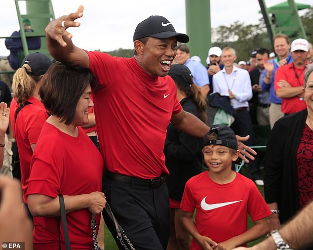 Woods wears his infamous Sunday Red, while his son Charlie also wears Nike, at the 2019 Masters