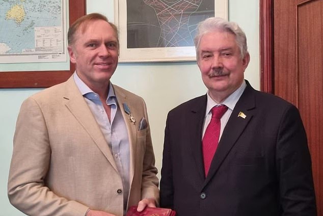 McRae received a Badge of Honor from Russian opposition candidate Sergey Baburin while participating in an election observation program in Moscow this month.