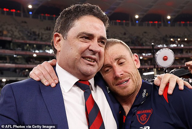 AFL great Garry Lyon (pictured with Demons coach Simon Goodwin after winning the 2021 Grand Final) was equally stunned.