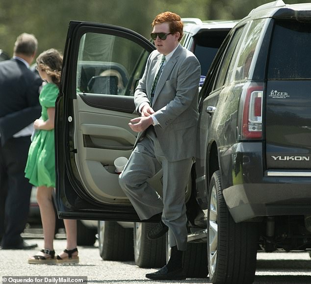Buster, 30, unmistakable by the distinctive red hair he and his late brother Paul inherited from their father, Alex Murdaugh, wore a gray suit and sunglasses for the service.