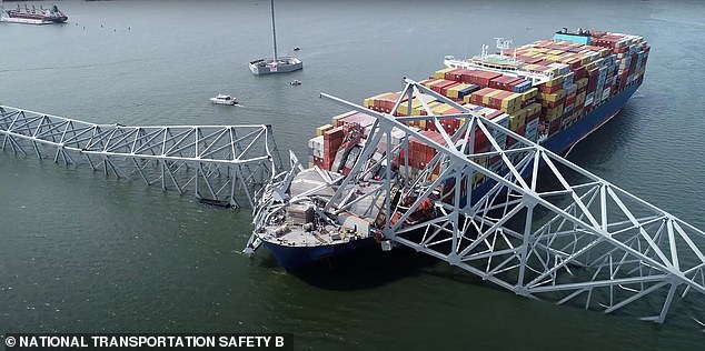 The 50 m wide ship is abandoned under the bridge.  The ship's crew may not be able to abandon ship under the bridge.  The debris has been removed.