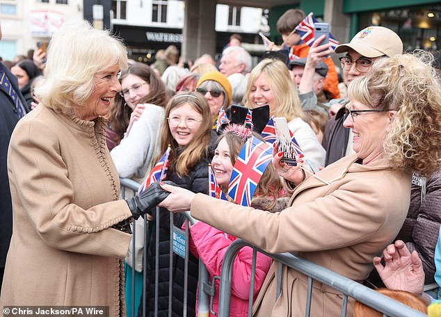 Queen Camilla greets well-wishers during a visit to the farmers market in Shrewsbury