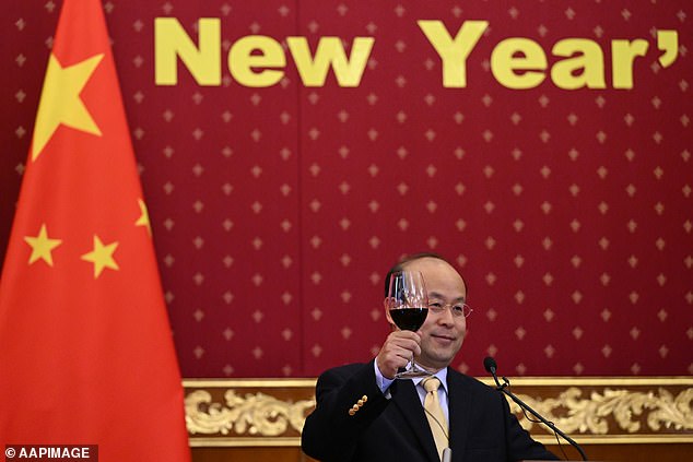 Chinese ambassador to Australia Xiao Qian raises a glass