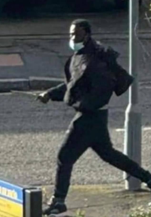 The attacker is apparently seen walking down the street with a large knife in his hand.