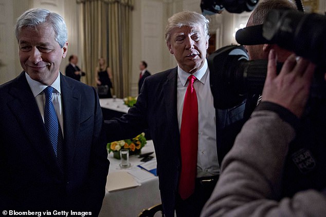 US President Donald Trump, with Jamie Dimon, CEO of JPMorgan Chase & Co., left.