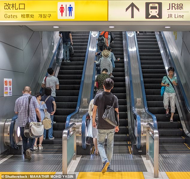Mamoru Suzuki, 72, collapsed at JR Mito station in the eastern Japanese city of Mito after the back of his jacket became caught in an escalator that connects the station's platform to the ticket sales area (archive image of escalators in Tokyo)