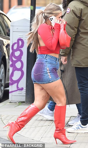 Liberty was wearing the same red crop top and mini skirt that she wore to the Boohoo event.