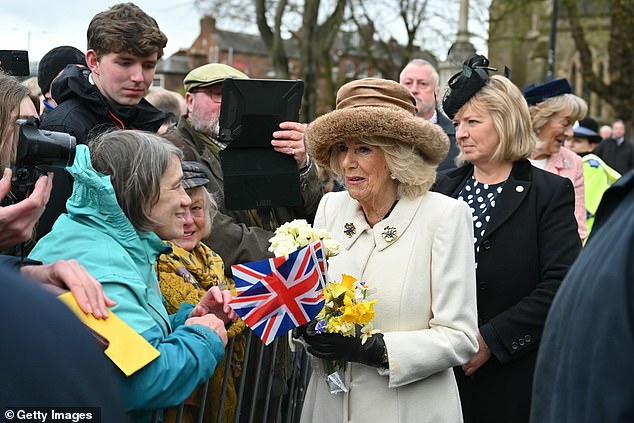 Queen Camilla comes out to greet well-wishers in Worcester after attending today's service.