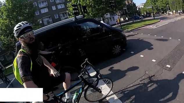 People on social media questioned why the bearded man, pictured, encouraged the cyclist to risk his life.