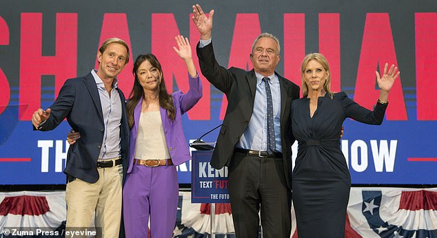 Robert F. Kennedy Jr. (center right) and his wife, actress Cheryl Hines (right), onstage in Oakland on Tuesday with his new running mate Nicole Shanahan (center left) and running mate Jacob Strumwasser (left).
