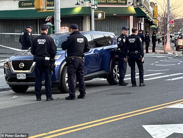 Neighbors heard gunshots at 5:50 p.m., less than two blocks from the NYPD's 101st Precinct precinct, before seeing the fatally wounded officer lying in the street.