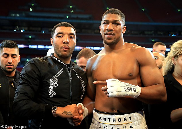 Troy Deeney (left) and Anthony Joshua (right) became friends after meeting in a barbershop.