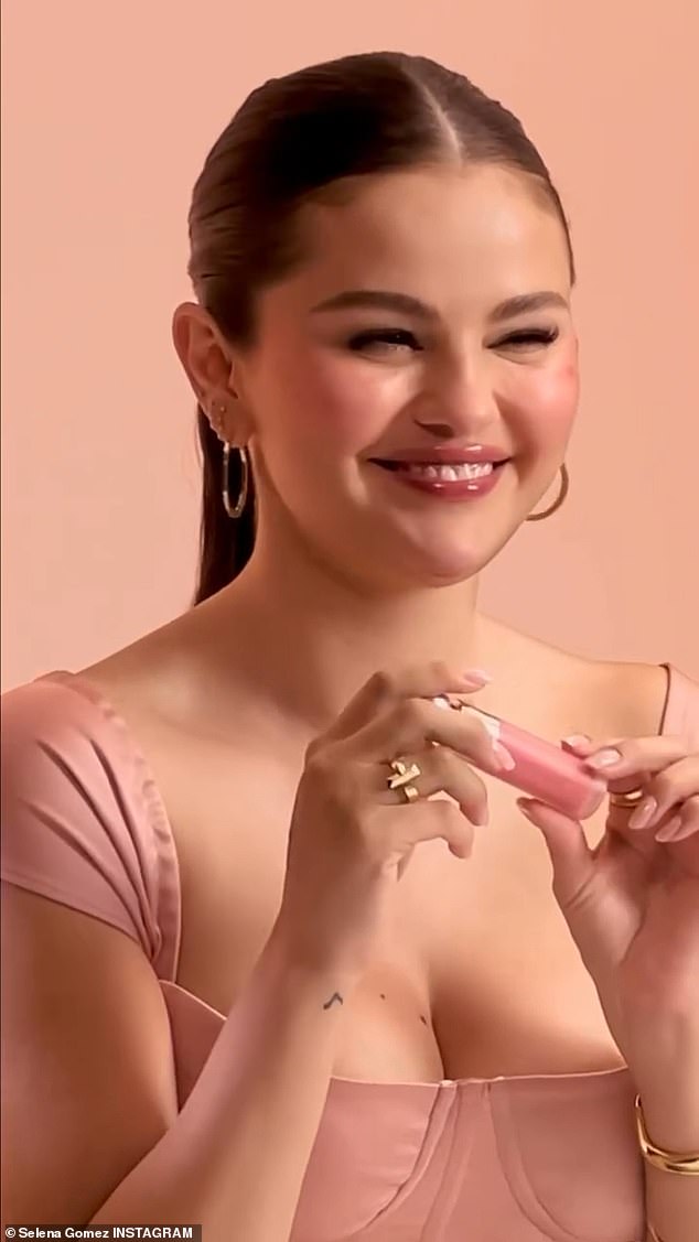 The star looked gorgeous in a pink top while holding one of the brand's iconic blushes.