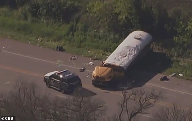 Aerial footage taken after the collision shows debris strewn across the road, while the wrecked bus stands still and police surround it.