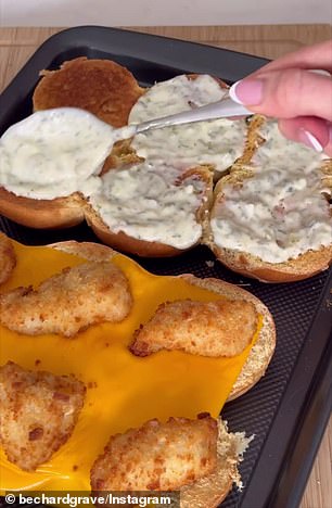Bec finishes her burgers and adds a bite of fish to each bun and a 15-gram scoop of her tartar sauce.